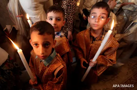 Palestinian Christians take part in the Greek Orthodox Christian Palm Sunday celebrations at St.Porphyrios Church in Gaza City, on April 24, 2016. Palm Sunday marks the triumphant return of Jesus Christ to Jerusalem when...
