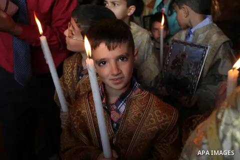 Palestinian Christians take part in the Greek Orthodox Christian Palm Sunday celebrations at St.Porphyrios Church in Gaza City, on April 24, 2016. Palm Sunday marks the triumphant return of Jesus Christ to Jerusalem when...