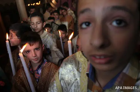 Palestinian Christians take part in the Greek Orthodox Christian Palm Sunday celebrations at St.Porphyrios Church in Gaza City, on April 24, 2016. Palm Sunday marks the triumphant return of Jesus Christ to Jerusalem when...