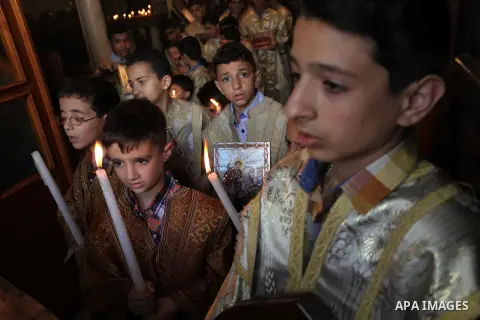Palestinian Christians take part in the Greek Orthodox Christian Palm Sunday celebrations at St.Porphyrios Church in Gaza City, on April 24, 2016. Palm Sunday marks the triumphant return of Jesus Christ to Jerusalem when...