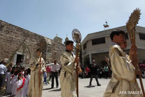 Palestinian Christians take part in the Greek Orthodox Christian Palm Sunday celebrations at St.Porphyrios Church in Gaza City, on April 24, 2016. Palm Sunday marks the triumphant return of Jesus Christ to Jerusalem when...