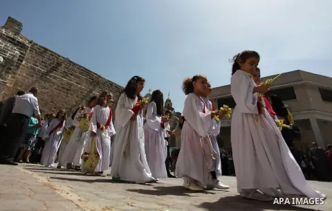 Palestinian Christians take part in the Greek Orthodox Christian Palm Sunday celebrations at St.Porphyrios Church in Gaza City, on April 24, 2016. Palm Sunday marks the triumphant return of Jesus Christ to Jerusalem when...