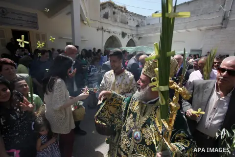 Palestinian Christians take part in the Greek Orthodox Christian Palm Sunday celebrations at St.Porphyrios Church in Gaza City, on April 24, 2016. Palm Sunday marks the triumphant return of Jesus Christ to Jerusalem when...