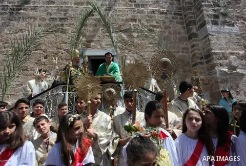 Palestinian Christians take part in the Greek Orthodox Christian Palm Sunday celebrations at St.Porphyrios Church in Gaza City, on April 24, 2016. Palm Sunday marks the triumphant return of Jesus Christ to Jerusalem when...