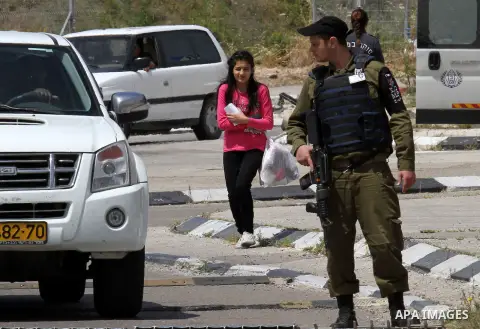 Released Palestinian prisoner Deema Al-Wawi, 12, who was detained by Israeli authorities for around two and half months, arrives following her release near the West Bank city of Tulkarm April 24, 2016. Photo by Nedal Esh...
