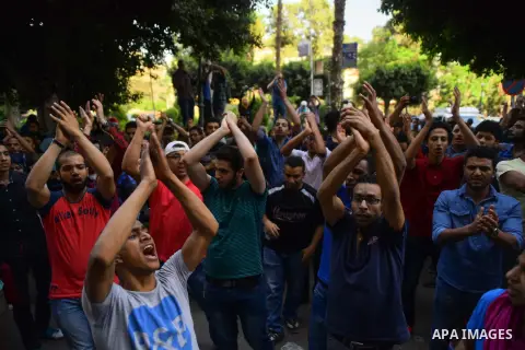 Egyptian protesters chant slogans during a demonstration in Cairo on April 25, 2016, against the handing over of two Red Sea islands to Saudi Arabia. Egyptian police fired tear gas at protesters in the Egyptian capital w...
