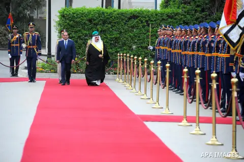 A handout picture released by the Egyptian Presidency on April 26, 2016 shows Egyptian President Abdel Fattah al-Sisi and Bahrain's King Hamad bin Issa al-Khalifa reviewing the honor guard during a welcoming ceremony in...