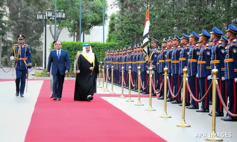 A handout picture released by the Egyptian Presidency on April 26, 2016 shows Egyptian President Abdel Fattah al-Sisi and Bahrain's King Hamad bin Issa al-Khalifa reviewing the honor guard during a welcoming ceremony in...