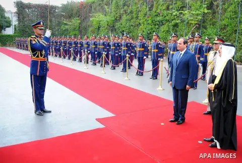A handout picture released by the Egyptian Presidency on April 26, 2016 shows Egyptian President Abdel Fattah al-Sisi and Bahrain's King Hamad bin Issa al-Khalifa reviewing the honor guard during a welcoming ceremony in...