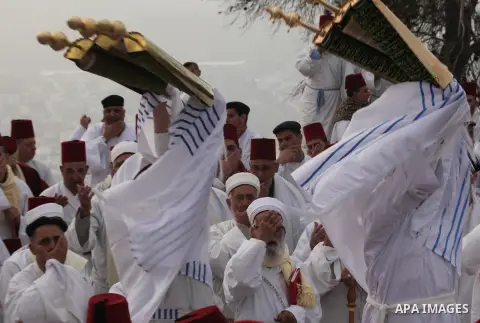 Members of the Samaritan sect take part in a traditional pilgrimage marking the holiday of Passover atop Mount Gerizim near the West Bank city of Nablus, on April 27, 2015. Photo by Nedal Eshtayah