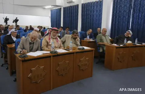 Members of the Palestinian legislative council from Hamas movement attend a meeting at the legislative council in Gaza city on, on April 27, 2016. Photo by Mohammed Asad