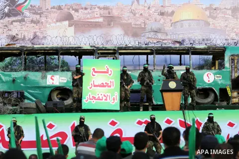 A member of the Ezzedine al-Qassam Brigades, the military wing of the Palestinian Islamist movement Hamas, delivers a speech during an anti-Israel rally in Gaza City on April 28, 2016. Photo by Mohammed Asad