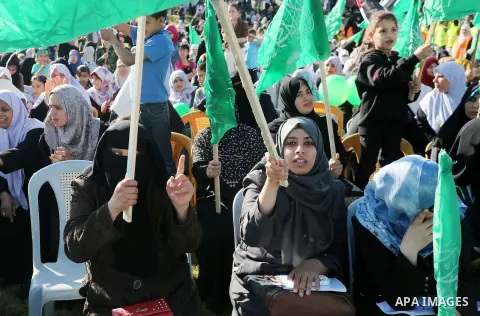 Palestinian supporters of the Islamist movement Hamas take part during an anti-Israel rally in Gaza City on April 28, 2016. Photo by Mohammed Asad