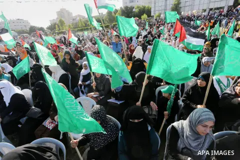 Palestinian supporters of the Islamist movement Hamas take part during an anti-Israel rally in Gaza City on April 28, 2016. Photo by Mohammed Asad