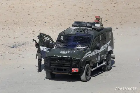 Israeli border guards hold a position during clashes with Palestinian stone throwers on April 29, 2016, following a demonstration in solidarity with Palestinian prisoners held in Israeli jails, outside the compound of th...