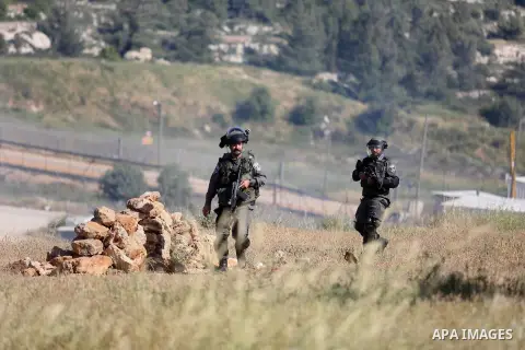 Israeli border guards hold a position during clashes with Palestinian stone throwers on April 29, 2016, following a demonstration in solidarity with Palestinian prisoners held in Israeli jails, outside the compound of th...
