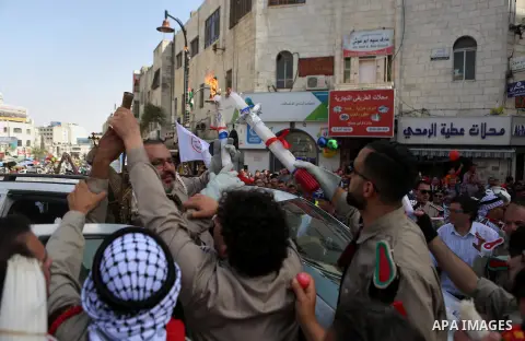 Palestinian christians march in the traditional Sabt al-Nour parade, in the West Bank city of Ramallah, on April 30, 2016. The Holy Fire is described by Orthodox Christians as a miracle that occurs every year at the Chur...
