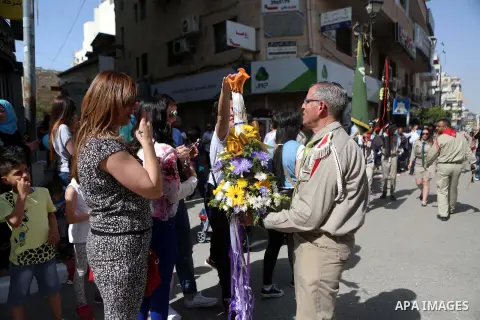 Palestinian christians march in the traditional Sabt al-Nour parade, in the West Bank city of Ramallah, on April 30, 2016. The Holy Fire is described by Orthodox Christians as a miracle that occurs every year at the Chur...