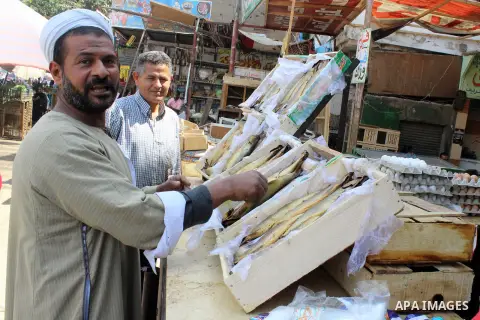Egyptians buy the Herring or, salted fish during preparation for the upcoming the Sham El Nessim, or the Festival of Spring Breeze, which marks the beginning of spring, in Cair, on April 30, 2016. Photo by Amr Sayed