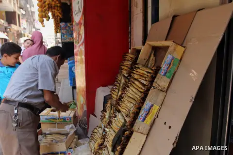 Egyptians buy the Herring or, salted fish during preparation for the upcoming the Sham El Nessim, or the Festival of Spring Breeze, which marks the beginning of spring, in Cair, on April 30, 2016. Photo by Amr Sayed