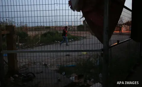 Palestinian labourers working in Israel wait to cross a checkpoint to go to work through the main Israeli terminal near the West Bank town of Qalqilya on International Workers' Day May 1, 2016. Photo by Stringer