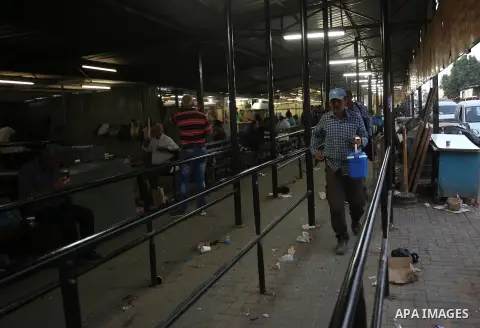 Palestinian labourers working in Israel wait to cross a checkpoint to go to work through the main Israeli terminal near the West Bank town of Qalqilya on International Workers' Day May 1, 2016. Photo by Stringer