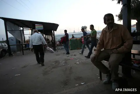 Palestinian labourers working in Israel wait to cross a checkpoint to go to work through the main Israeli terminal near the West Bank town of Qalqilya on International Workers' Day May 1, 2016. Photo by Stringer