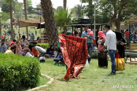 Egyptian children play at a garden marking Sham el-Nessim, or smelling the breeze which marks the beginning of spring, in Cairo, on May 02, 2016. Photo by Amr Sayed