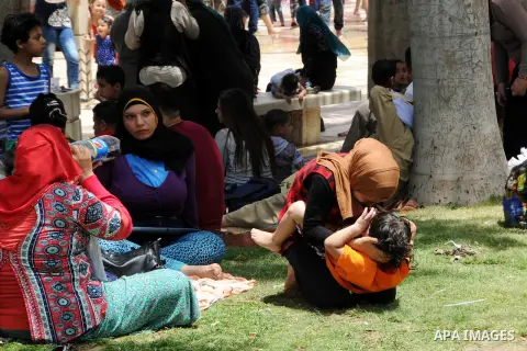 Egyptians gather at a garden marking Sham el-Nessim, or smelling the breeze which marks the beginning of spring, in Cairo, on May 02, 2016. Photo by Amr Sayed
