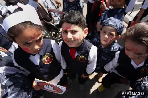 Palestinian children take part during a day where the traffic police have increased presence in the streets to raise traffic awareness in Gaza City on May 4, 2016. Photo by Ashraf Amra
