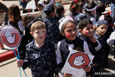 Palestinian children take part during a day where the traffic police have increased presence in the streets to raise traffic awareness in Gaza City on May 4, 2016. Photo by Ashraf Amra