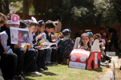 Palestinian children take part during a day where the traffic police have increased presence in the streets to raise traffic awareness in Gaza City on May 4, 2016. Photo by Ashraf Amra