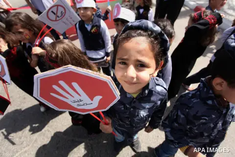 Palestinian children take part during a day where the traffic police have increased presence in the streets to raise traffic awareness in Gaza City on May 4, 2016. Photo by Ashraf Amra