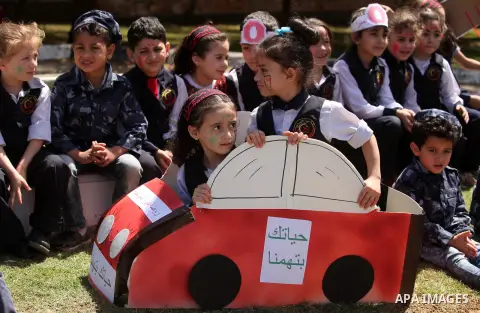 Palestinian children take part during a day where the traffic police have increased presence in the streets to raise traffic awareness in Gaza City on May 4, 2016. Photo by Ashraf Amra