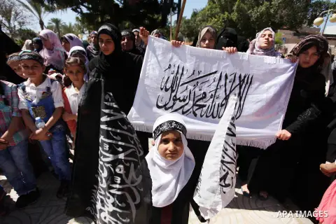Palestinian supporters of the Islamist party Hizb Ut-Tahrir take part in a rally to mark the 95th anniversary of the overthrow of the Islamic Caliphate, in Gaza city on May 5, 2016. Photo by Ashraf Amra