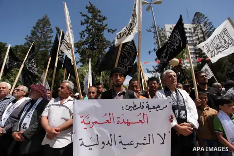 Palestinian supporters of the Islamist party Hizb Ut-Tahrir take part in a rally to mark the 95th anniversary of the overthrow of the Islamic Caliphate, in Gaza city on May 5, 2016. Photo by Ashraf Amra