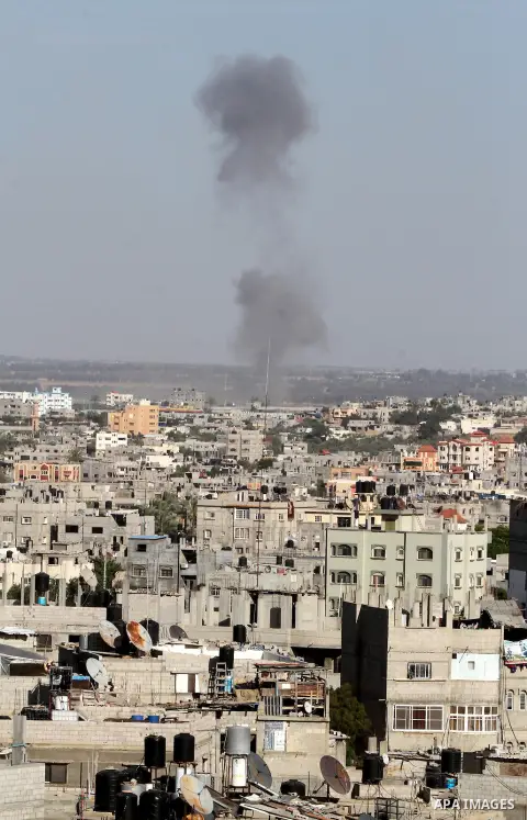 Smoke rises following an Israeli air strike in Rafah, in the southern Gaza Strip, on May 5, 2016. Israeli warplanes struck four new Hamas positions in the southern Gaza Strip, as a flare-up continued to threaten a 2014 c...