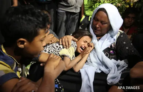 Relatives of Zine al-Umur, 55, who lost her life after Israeli warplanes bombed around Gaza's southern, during a funeral ceremony in east of the Rafah city, Gaza on May 5, 2016.. Photo by Ramadan Elagha