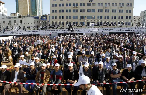 Palestinian supporters of the Islamist party Hizb Ut-Tahrir take part in a rally to mark the 95th anniversary of the overthrow of the Islamic Caliphate, in the West Bank city of Hebron on May 7, 2016. Photo by Wisam Hash...