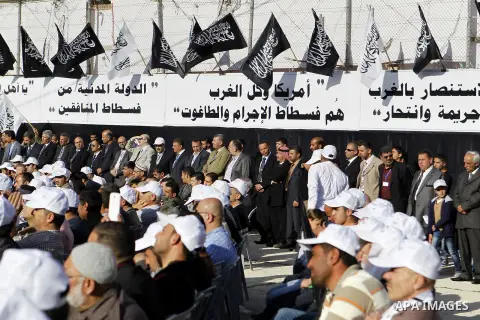 Palestinian supporters of the Islamist party Hizb Ut-Tahrir take part in a rally to mark the 95th anniversary of the overthrow of the Islamic Caliphate, in the West Bank city of Hebron on May 7, 2016. Photo by Wisam Hash...
