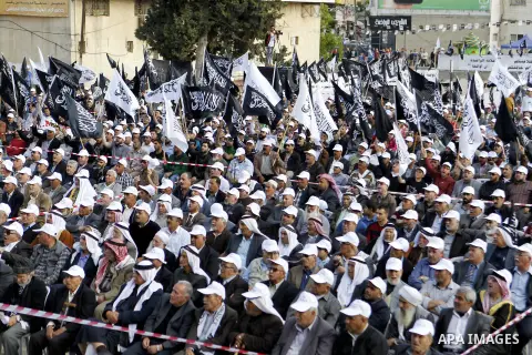 Palestinian supporters of the Islamist party Hizb Ut-Tahrir take part in a rally to mark the 95th anniversary of the overthrow of the Islamic Caliphate, in the West Bank city of Hebron on May 7, 2016. Photo by Wisam Hash...