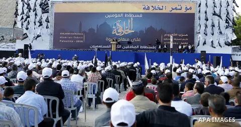 Palestinian supporters of the Islamist party Hizb Ut-Tahrir take part in a rally to mark the 95th anniversary of the overthrow of the Islamic Caliphate, in the West Bank city of Hebron on May 7, 2016. Photo by Wisam Hash...