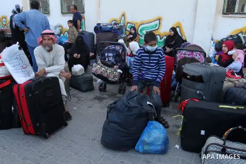 Palestinians wait at the Rafah border crossing with Egypt, in the southern Gaza Strip, after it was opened for two days by Egyptian authorities on May 12, 2016. Israeli Defence Minister Moshe Yaalon announced on May 2, 2...