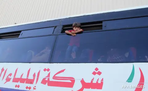 Palestinians wait at the Rafah border crossing with Egypt, in the southern Gaza Strip, after it was opened for two days by Egyptian authorities on May 12, 2016. Israeli Defence Minister Moshe Yaalon announced on May 2, 2...