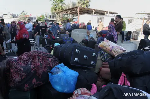 Palestinians wait at the Rafah border crossing with Egypt, in the southern Gaza Strip, after it was opened for two days by Egyptian authorities on May 12, 2016. Israeli Defence Minister Moshe Yaalon announced on May 2, 2...