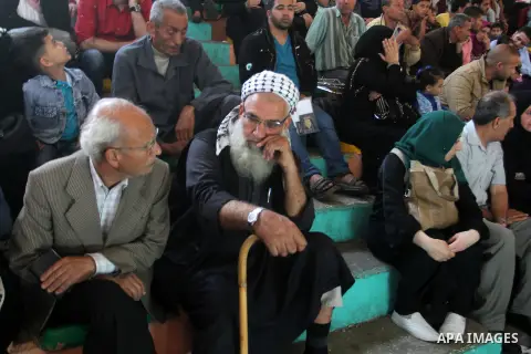Palestinians wait at the Rafah border crossing with Egypt, in the southern Gaza Strip, after it was opened for two days by Egyptian authorities on May 12, 2016. Israeli Defence Minister Moshe Yaalon announced on May 2, 2...