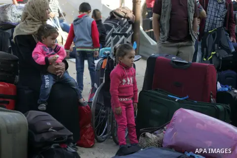 Palestinians wait at the Rafah border crossing with Egypt, in the southern Gaza Strip, after it was opened for two days by Egyptian authorities on May 12, 2016. Israeli Defence Minister Moshe Yaalon announced on May 2, 2...