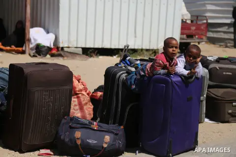 Palestinians wait at the Rafah border crossing with Egypt, in the southern Gaza Strip, after it was opened for two days by Egyptian authorities on May 12, 2016. Israeli Defence Minister Moshe Yaalon announced on May 2, 2...