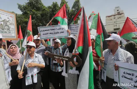 Palestinians wave national flags on May 15, 2016 in Gaza city during a rally to commemorate the "Nakba" or "catastrophe" in Arabic in reference to the establishment in 1948 of the state of Israel. "Nakba" means in Arabic...