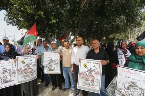 Palestinians wave national flags on May 15, 2016 in Gaza city during a rally to commemorate the "Nakba" or "catastrophe" in Arabic in reference to the establishment in 1948 of the state of Israel. "Nakba" means in Arabic...